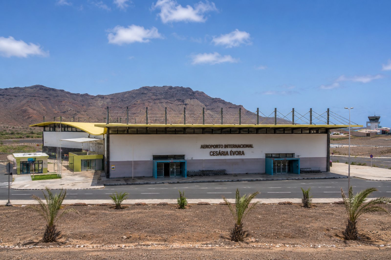 The terminal building of Cesária Évora International Airport on São Vicente, with dry mountains behind, Cape Verde