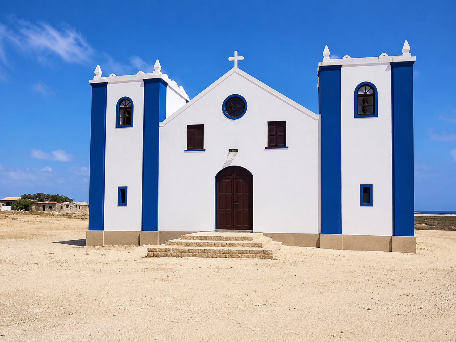 A quiet golden-sand bay with green hills and villagers carrying baskets, Cape Verde