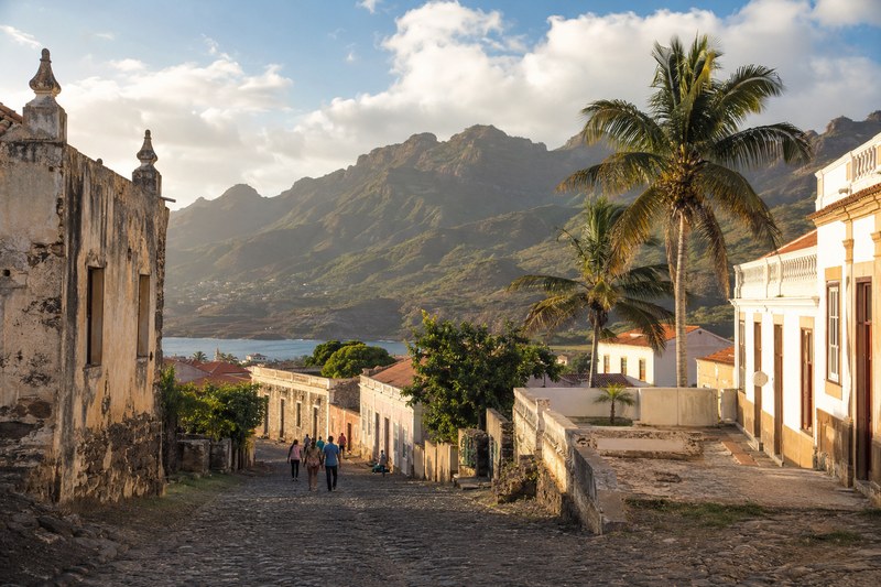 Historic colonial street with palm trees on Santiago island, Cape Verde