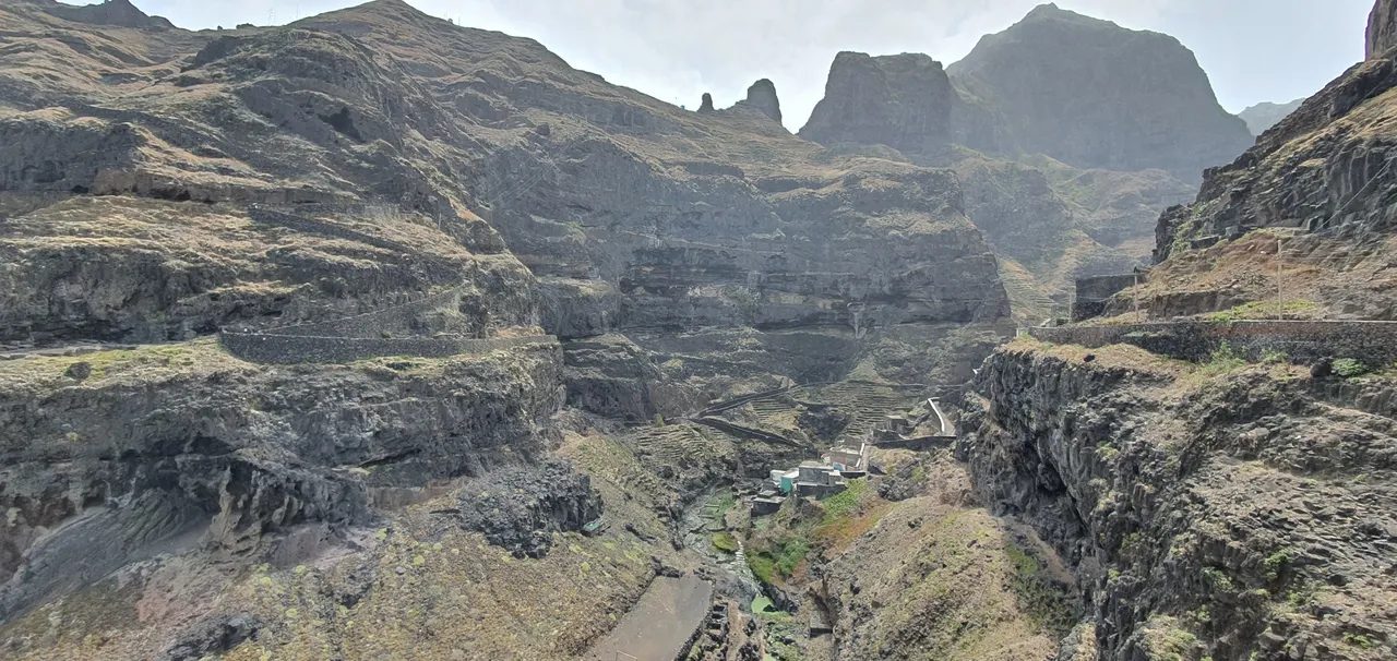 Deep rocky valley with terraced fields and a few houses at the bottom, Ribeira do Corvo, Santo Antão